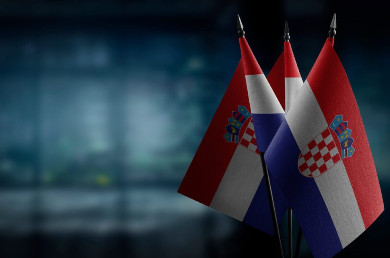 Small,Flags,Of,The,Croatia,On,An,Abstract,Blurry,Background.