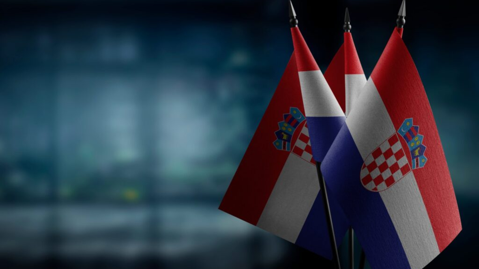 Small,Flags,Of,The,Croatia,On,An,Abstract,Blurry,Background.
